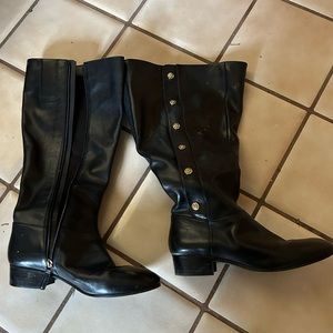 Black leather boots with gold detail, slightly worn; no heel. Size 8.